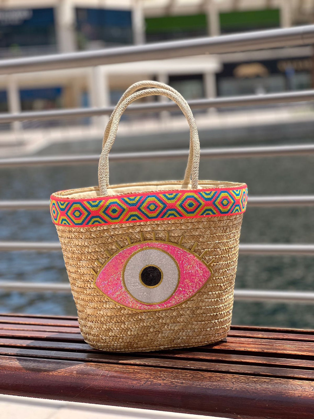 Straw Basket with pink evil eye design