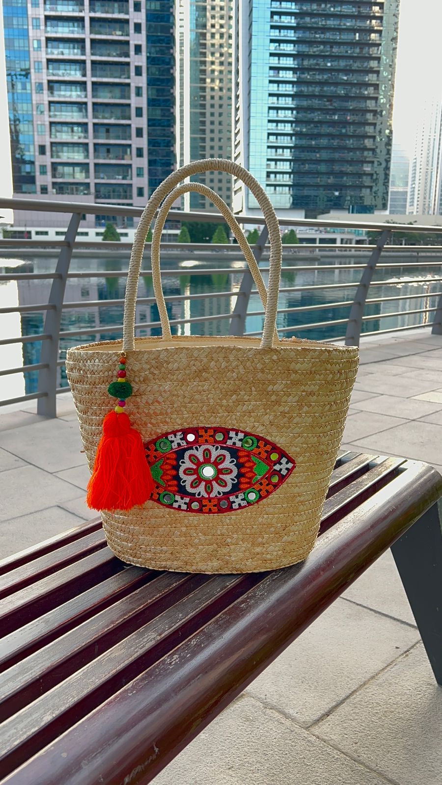 Rope basket with embroidered evil eye and tassel