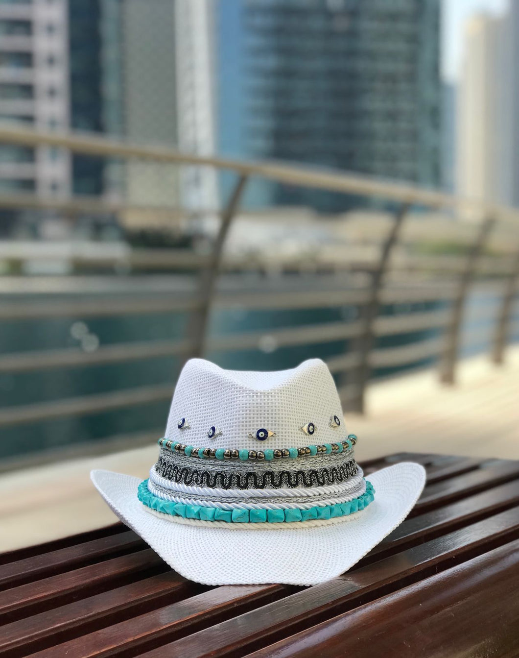 White cowboy hat with small eyes