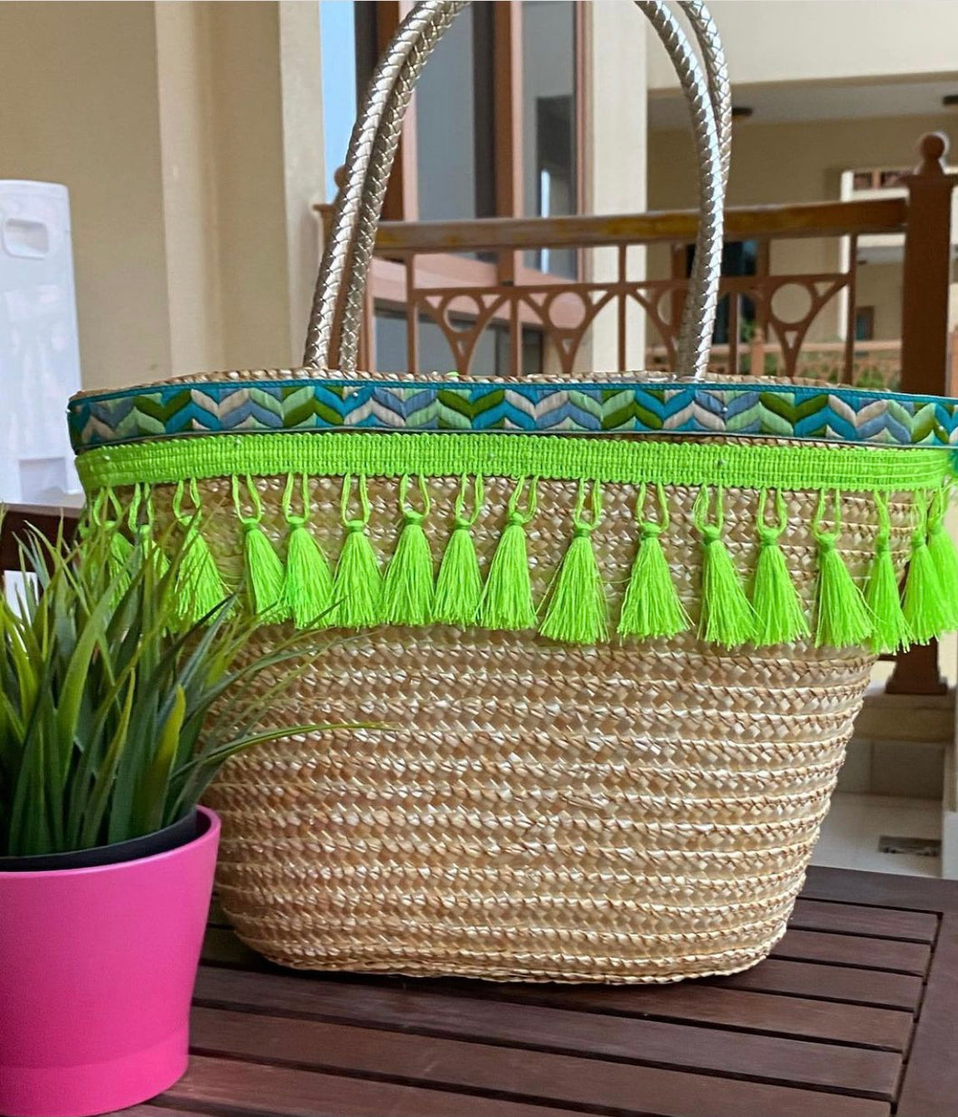 Straw basket with green tassel