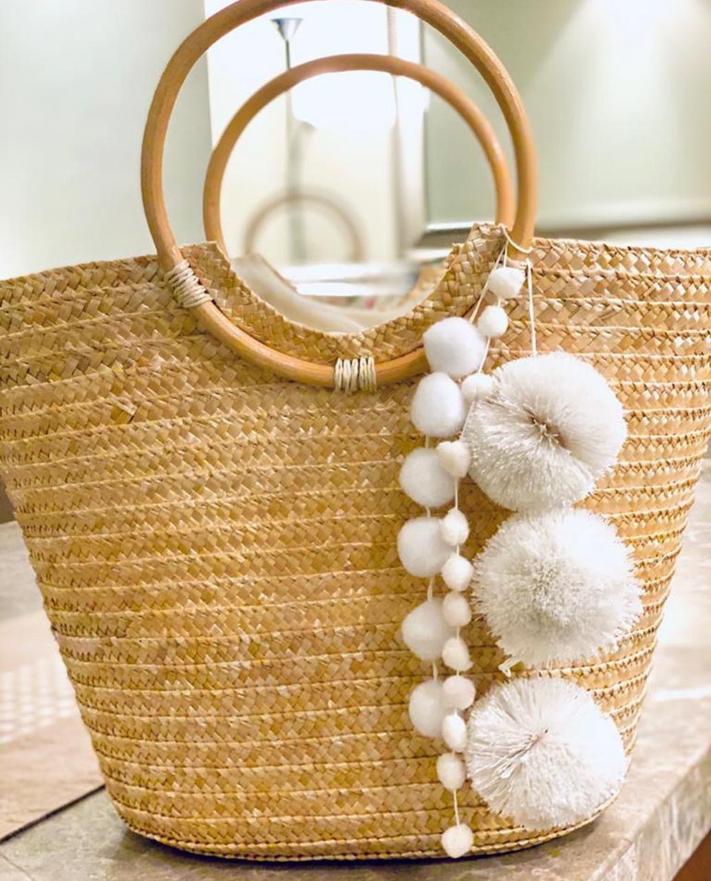 Wooden bag with white pompoms