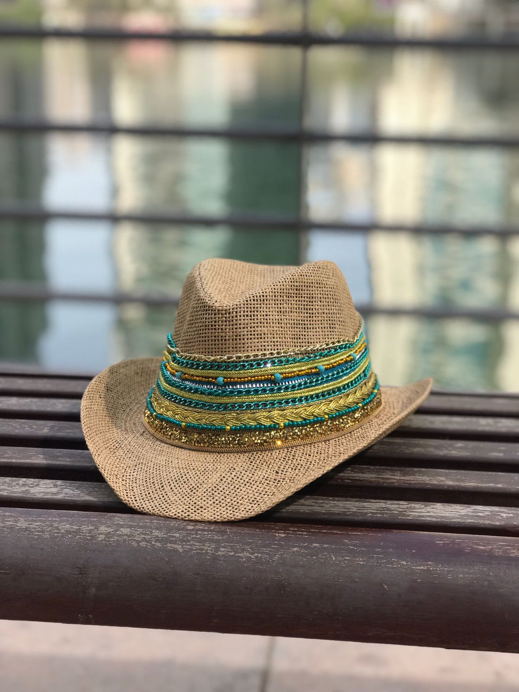 Cowboy hat with blue & gold chain